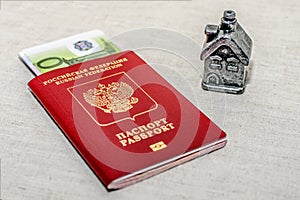 Red russian Passport, money and home - the concept of buying a property.