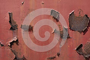 Red rusted and scratched metal surface background texture