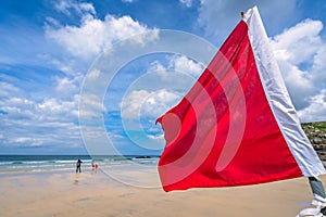 Red Safety Flag on a Cornish beach