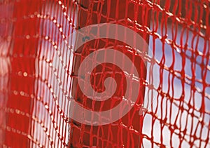 Red safety net at the edge of an alpine skiing slope