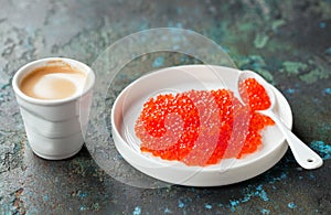 Red salmon caviar and a cup of coffee. Carnivore style diet