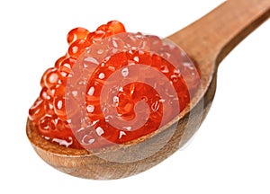 Red salmon caviar heap in wooden spoon