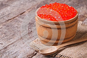 Red salmon caviar in a wooden keg