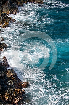 Red Sand Beach, Maui in in Hawaiian. Sea Wave and rock, summer beach background.