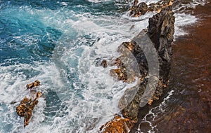 Red Sand Beach, Maui in in Hawaiian. Sea Wave and rock, summer beach background.