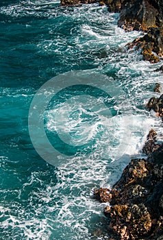 Red Sand Beach, Maui in in Hawaiian. Sea Wave and rock, summer beach background.