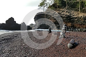 Red sand beach rock stacks