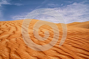 Red sand dunes with partly overcast sky, Moreeb dunes