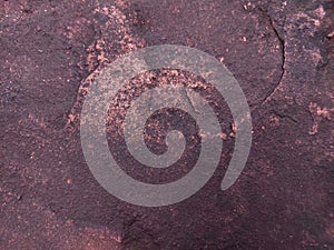 Red sand stone texture pattern on surface of the wall. flaking red sandstone rock surface with topographic texture.