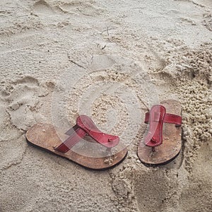 red sandals on white sand beaches alone focus