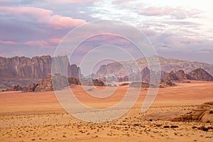 Red sands mountains, dramatic sky and marthian landscape panorama of Wadi Rum desert, Jordan