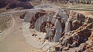 Red Sandstone Rock Formation in Mojave Desert California Aerial Shot Backward Tilt Up