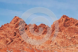 Red sandstone rock formations with blue sky