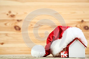 Red santa hat with house model