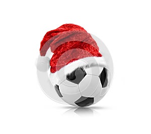 Red Santa Hat on a soccer ball isolated