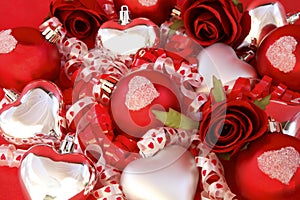 Red satin balls, silver hearts with roses and ribb