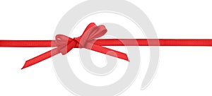 Red satin bow on ribbon line isolated on white