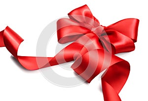 Red satin gift bow. Red ribbon isolated on white