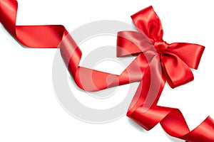 Red satin gift bow. Red ribbon isolated on white
