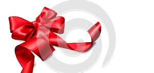 Red satin gift bow. Ribbon isolated on white