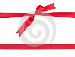 Red satin gift ribbon bow and ribbon without bow, isolated on white background, top view