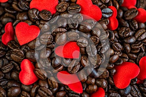 Red satin hearts on coffee beans, valentines or mothers day background, love celebrating