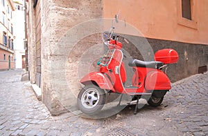 Red scooter alleyway cityscape Rome Italy