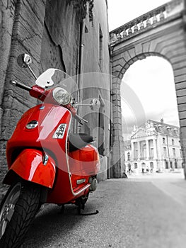 Red scooter with black & white surroundings