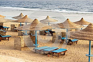 Red Sea beach with straw umbrellas - Marsa Alam Egypt Africa