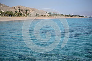 Red Sea turquoise water beach and mountains in Eilat, Israel