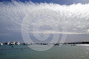 Red sea. View of the ships anchored and beautiful clouds. January in Egypt. Africa