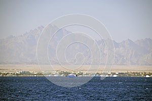 Red sea. View of the ships anchored and beautiful clouds. January in Egypt. Africa