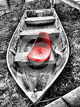 Red seat in old boat