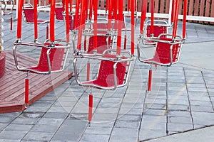 Red seats of a carousel