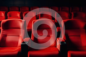Red seats in cinema or theatre interior. Empty movie theater. Copy space. Generative Ai
