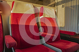 Red seats in first class compartment in czech train