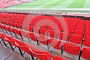 Red seats at football stadium.