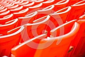 Red seats on stadium steps bleacher