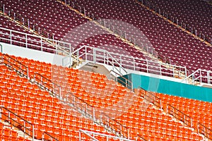 Red seats on stadium steps bleacher