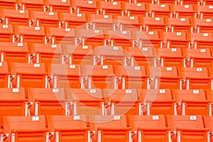 Red seats on stadium steps bleacher