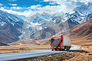 Red semi truck driving on scenic asphalt road through breathtaking snow-capped mountain landscape