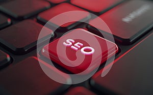 Red SEO key on computer keyboard. Conceptual image for search engine optimization.