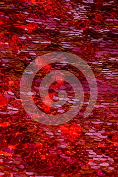 Red sequins pattern. Sparkling sequins background. Red sequin fabric for background. rectangular red shiny fabric