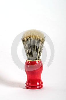 Red shaving brush isolated on a white background. Men`s Accessories. For catalog