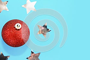 Red shiny christmas toys balls on the christmas tree for new year holiday