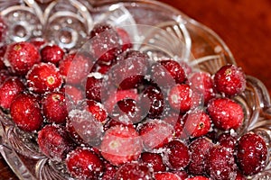 Red shiny cranberries covered with sugar