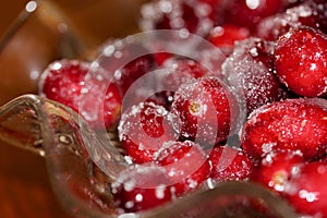 Red shiny cranberries covered with sugar