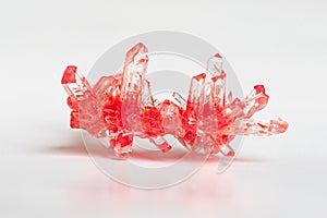 Red Shiny crystal on white