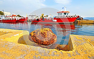 Red ships at Eleusis port Greece