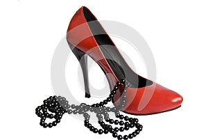 Red shoe and black beads